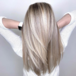 womans blonde highlights at the salon