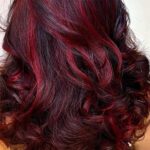 red accent foils highlights on woman hair salon plano master hairstylist