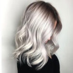 bold white blonde specialist with shadow root